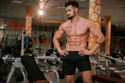 In front of the camera charismatic guy with a brutal face after his workout Stock Photos