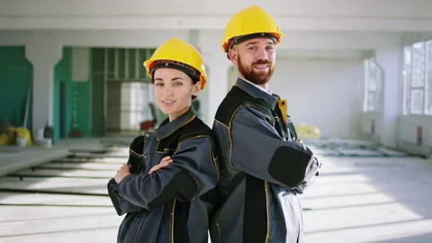 In front of the camera charismatic man construction worker and woman engineer Stock Footage 196311887