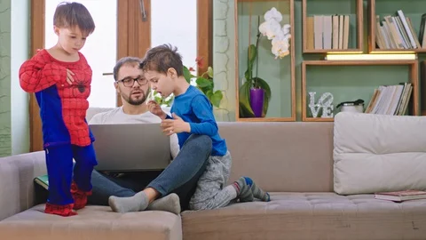 In front of the camera cute two kids and his dad have a fun time together they Stock Footage 127911428