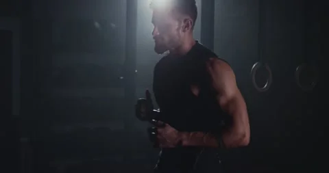 In front of the camera good looking guy in a dark cross fitness class he finish Stock-Footage 138108426