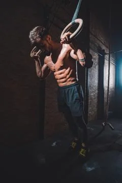In front of the camera good looking guy in a dark cross fitness class he finish Stock Photos