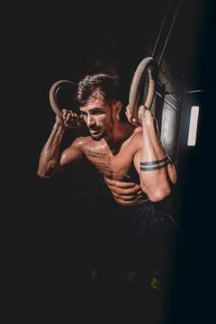 In front of the camera good looking guy in a dark cross fitness class he finish Stock Photos