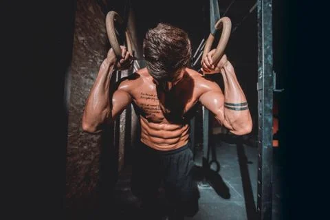 In front of the camera good looking guy in a dark cross fitness class he finish Stock Photos
