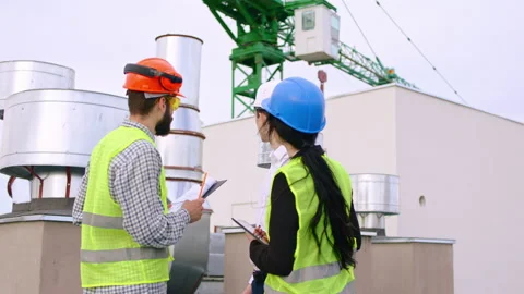 In front of the camera group of engineers and assistant have a discussing on top Video stock 143156429