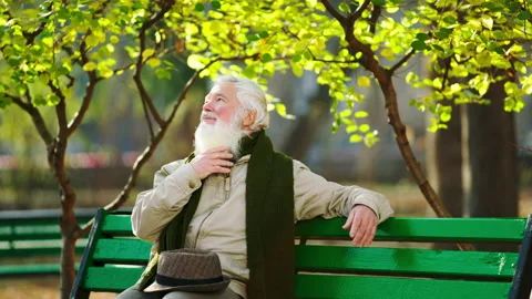 In front of the camera old man very charismatic have a walk in the middle of the Stock Footage 166635598
