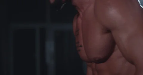 In front of the camera perfect muscle body of a young guy training hard at cross Video stock 118606255