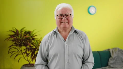 In front of the camera portrait of a charismatic old man posing in front of the Video stock 208926902