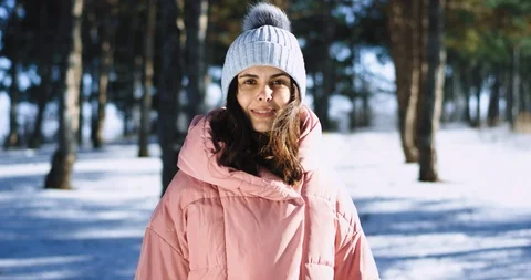 In front of the camera portrait of a young lady smiling large while wearing Stock Footage 112613705