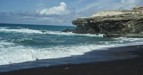 In front of the camera seaside landscape with black sand beach and amazing Stock Footage 131368181