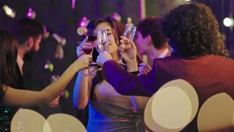 In front of the camera at stuff party group of beautiful ladies cheers with Video stock 138631783