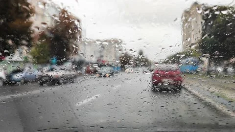 Front car window covered with rain drops 스톡 동영상 161266385