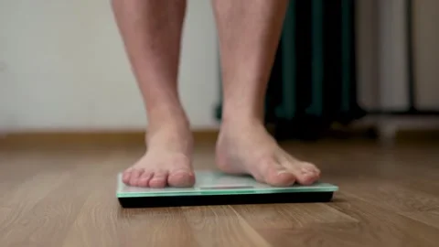 Front Close Up of Feet Balancing on Digital Scale Vídeo Stock 340220052