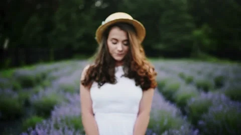 Front close up portrait of attractive joyful curly brunette woman on white dress Stock-Footage 178046824