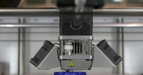 Front close-up view of 3d printer in process. It makes pieces for equipment with Stock Footage 68646735