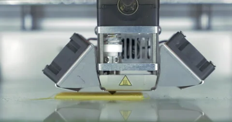 Front close-up view of 3d printer in process. It makes pieces for equipment with 動画素材 68647738