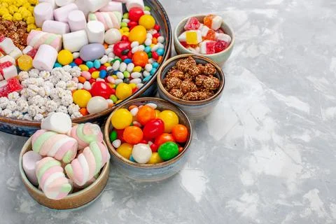 Front close view candy composition different colored candies with marshmall.. Stock Photos