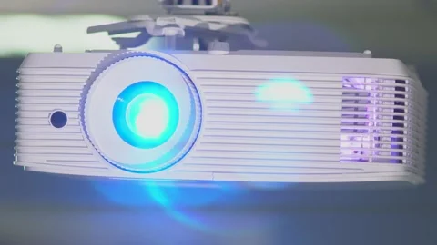 Front close-up view of overhead digital projector with lens switching on Video stock 158058058