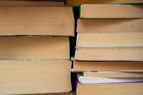 Front close-up view of stacked books and their pages Stock Photos