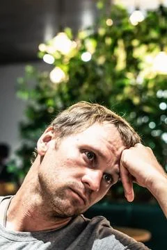 Front closeup vertical portrait Young serious pensive man thinki Foto stock