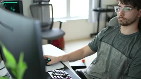 Front closeup view of young hip businessman in casual attire working on keyboard Stock Footage 151769148