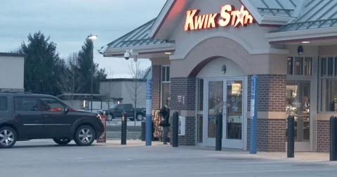 Front of a Convenience Store - Car Pulls Up - Dusk Stock Footage 74175615