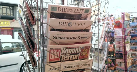 Front covers at press kiosk of German newspapers Stock Footage 57380749