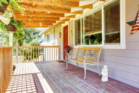 Front deck with antique bench Stock Photos