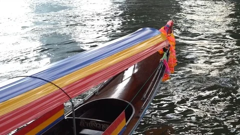 The front of a decorated long tail boat on the river Stock Footage