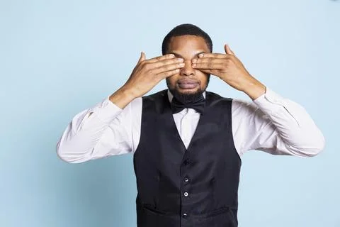 Front desk receptionist doing the three wise monkeys gesture Stockfoto's