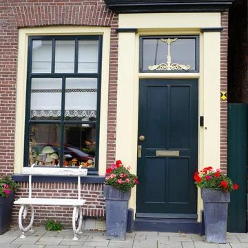 Front door and window of an old Dutch house Stock Photos