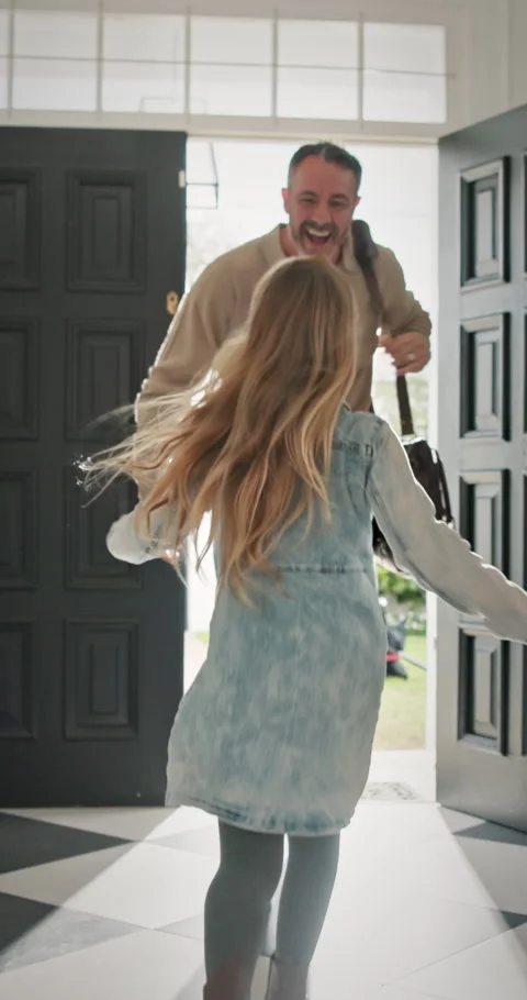 Front door, home and child running to dad for hug, welcome and greeting for Stock Footage 339049065