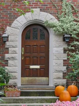 Front door with pumpkins Stock Photos