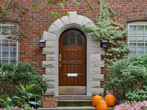 Front door with pumpkins Stock Photos