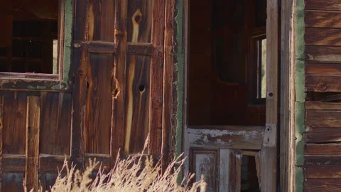 Front Door of Rustic Ghost Town Cabin with Sage Brush - Shallow DOF Stock Footage 144734889