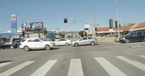 Front driving plate - La Brea Ave at Beverly Boulevard, Los Angeles Stock Footage 113763883