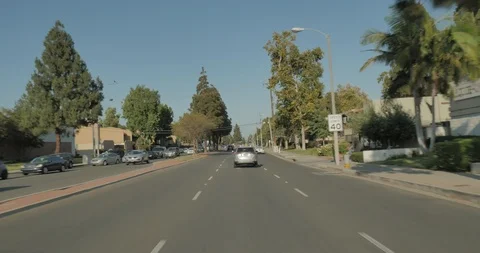 Front driving plate - West MacArthur Blvd at South Bristol St, Los Angeles Stock Footage 101932770