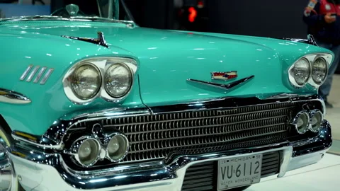 Front element of Classic turquoise 1958 Chevrolet Impala convertible displayed Video stock 330987726