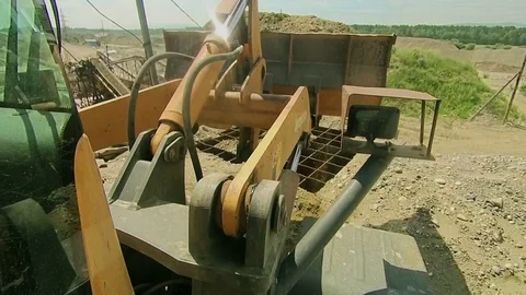 Front end bulldozer loads rocks Stock Footage 70353229