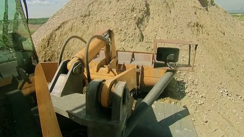 Front end bulldozer loads rocks Stock Footage 70353232