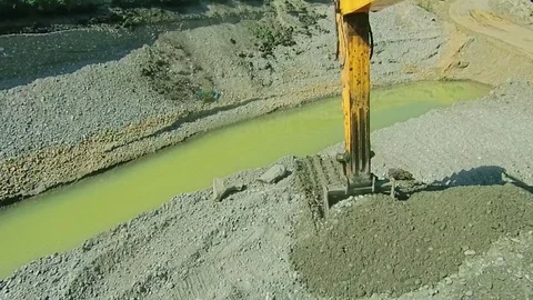 Front end bulldozer loads rocks in the truck Stock Footage 70353828