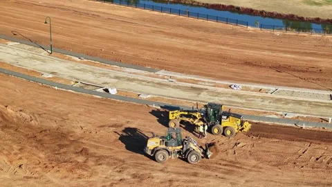 Front end loader and grader driver out of their machines discussing work Stock Footage 278340138