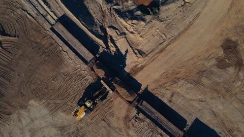 Front-end loader loading sand it to the freight train. Stock Footage 156624059
