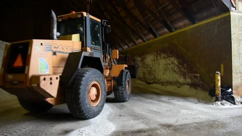 Front End Loader Picking Up Load of Road Salt During Winter Snow Storm Video stock 148703970