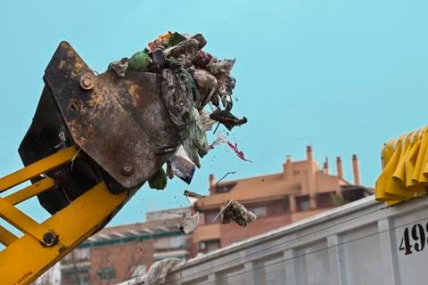 Front-end loader picking up trash Stock Photos