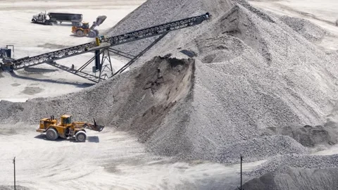 Front end loader working in an open pit mine quarry Stock Footage 343326515