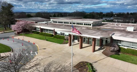 Front entrance of American school building. Dramatic sunny to cloudy Stock Footage 181955382