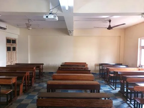 Front entry-view of college classroom with brown benches chairs &amp; furniture Stock Photos