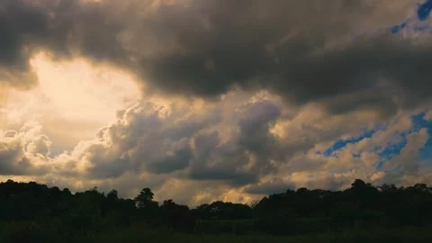 In front of eyes, billowing clouds fly over the mountain . Stock Footage 277947672