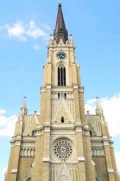 The front facade and bell, clock tower of the Name of Mary Church with its .. Stock Photos
