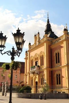 The front facade of the Bishops palace next to a street lamp in the old town  Stock Photos